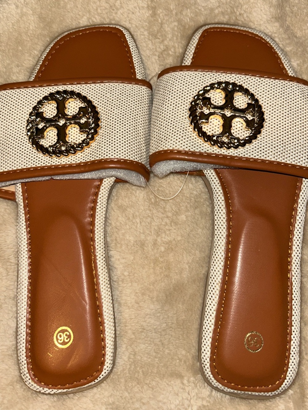 White & Tan Slide Mules with Gold Emblem